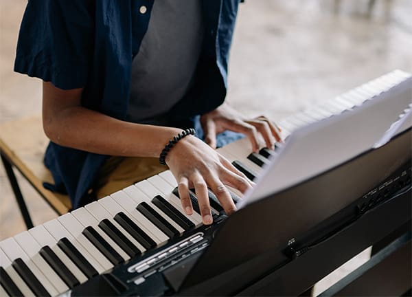 Kid playing on piano