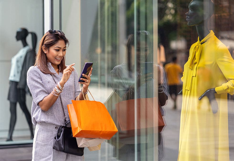 omnichannel marketing woman shopping and on phone